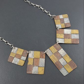 mixed metal bib necklace